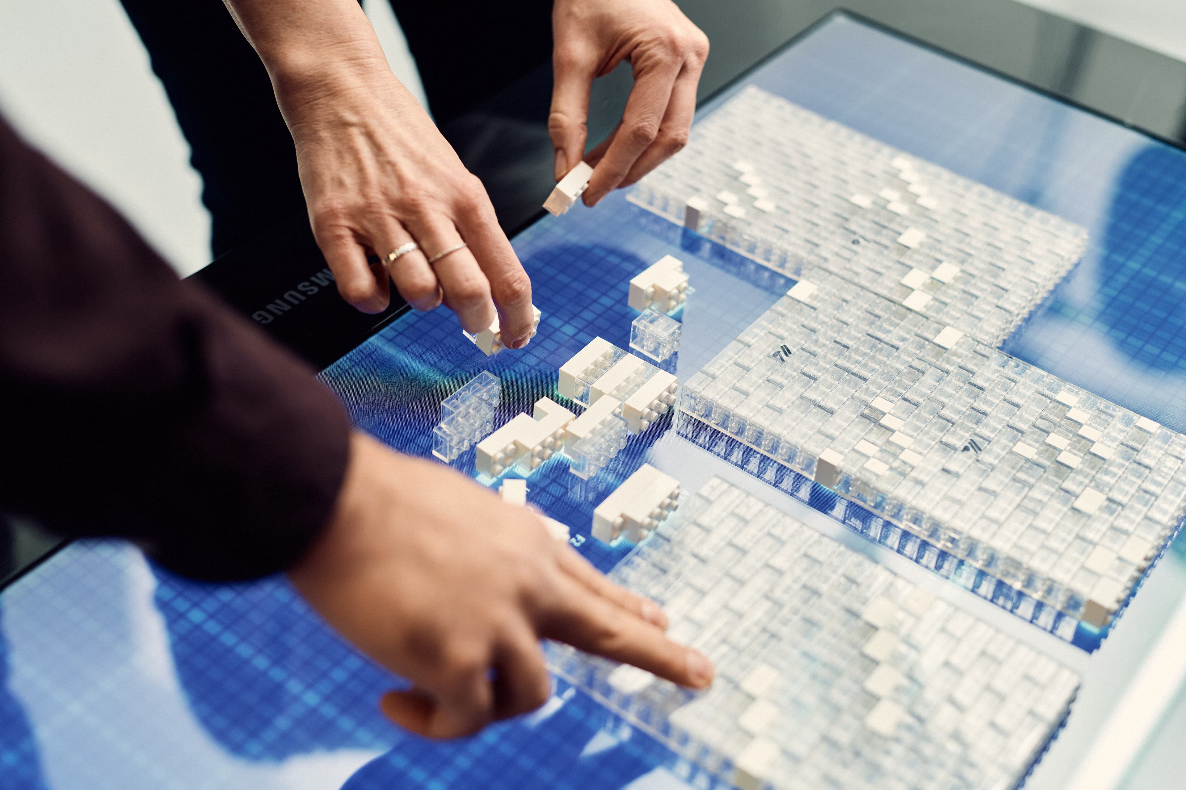 People using the LEGO table